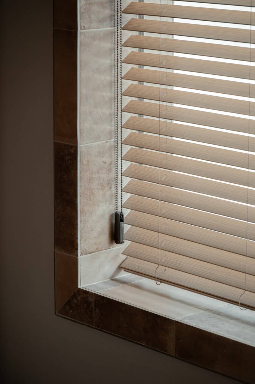 Wooden blinds and material details in the BAYIT lobby
