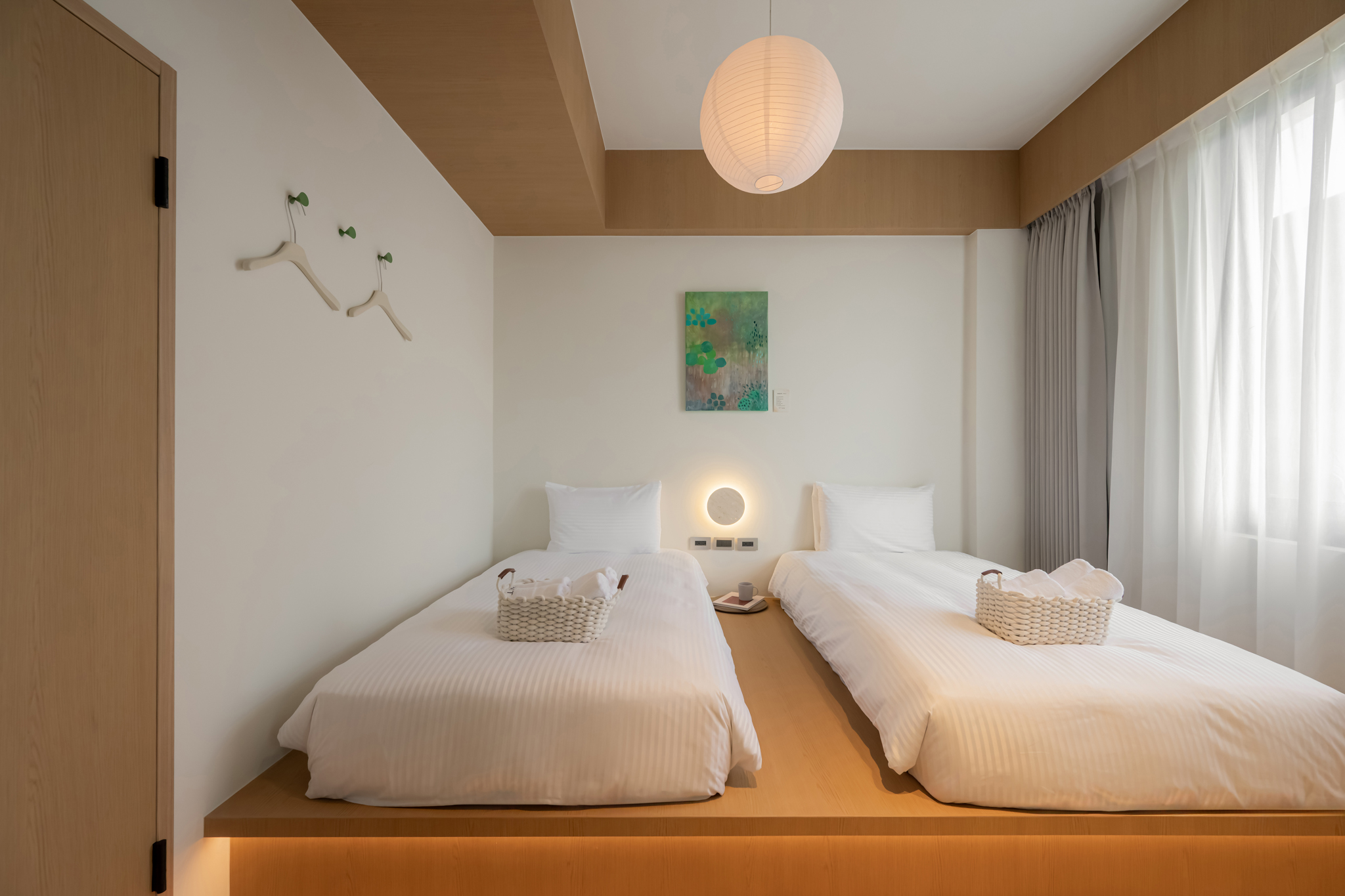Two extra-large single beds in the Verdant Suite