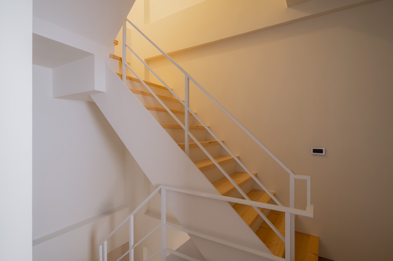 BAYIT staircase landing in warm light