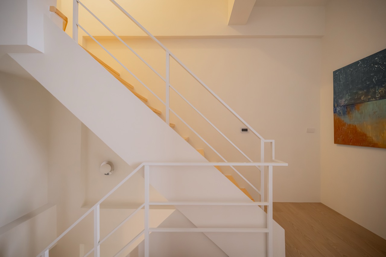 Abstract artwork at a BAYIT staircase landing